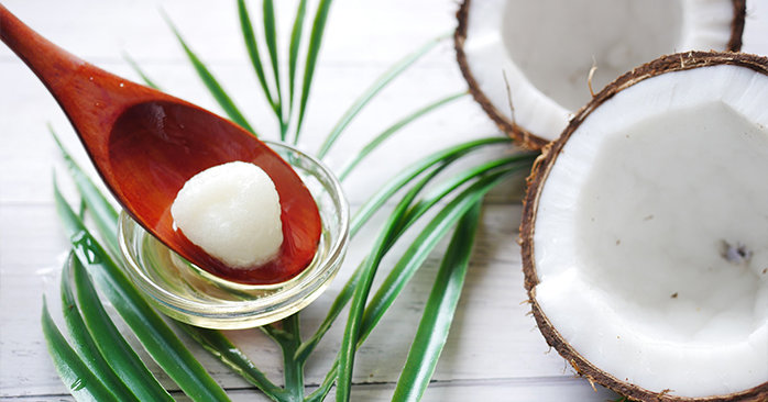 Spoon holding coconut oil